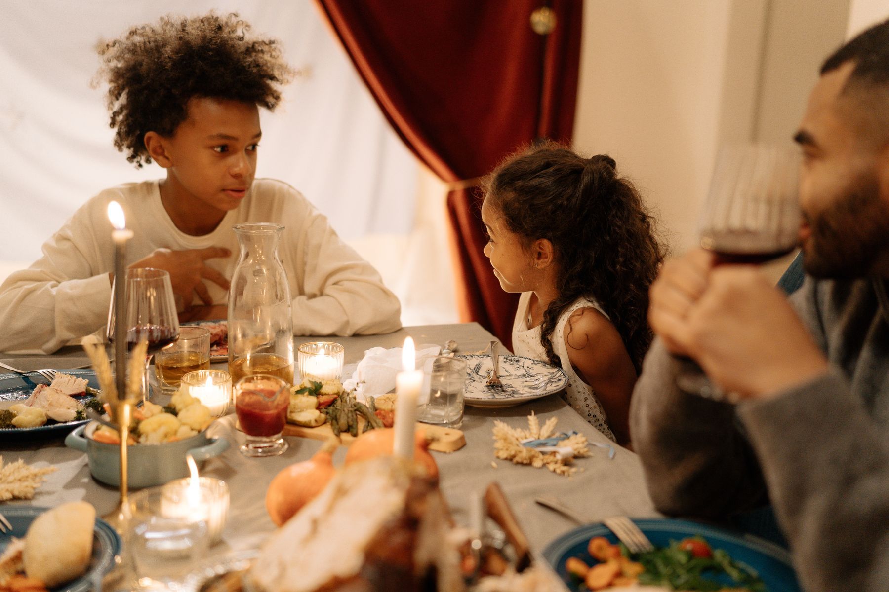 A family around a candlelit table
