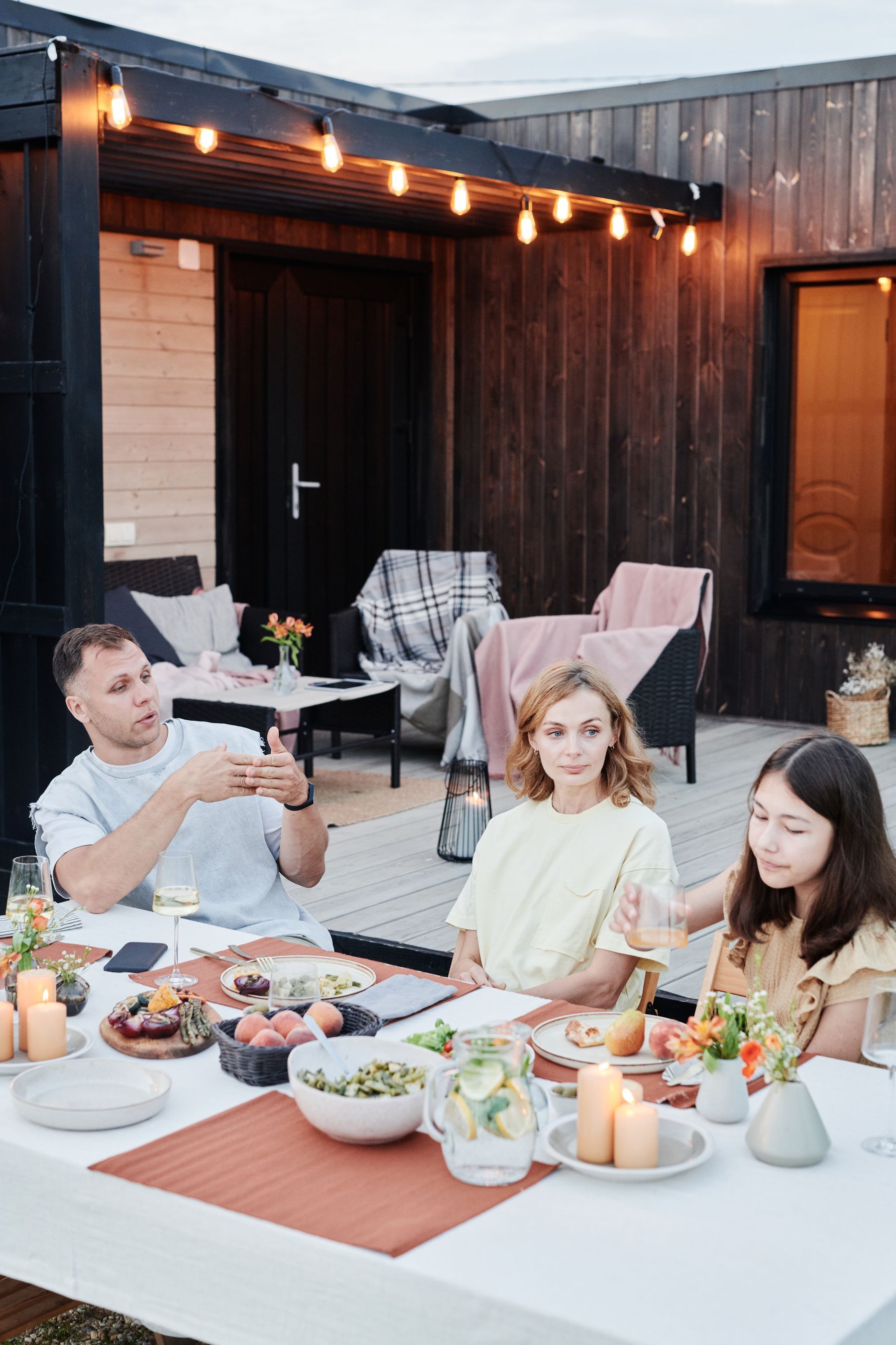 Families sharing a meal outdoors
